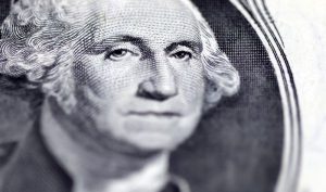 US dollar dips as Fed rate hike expectations wane, CAD steadies