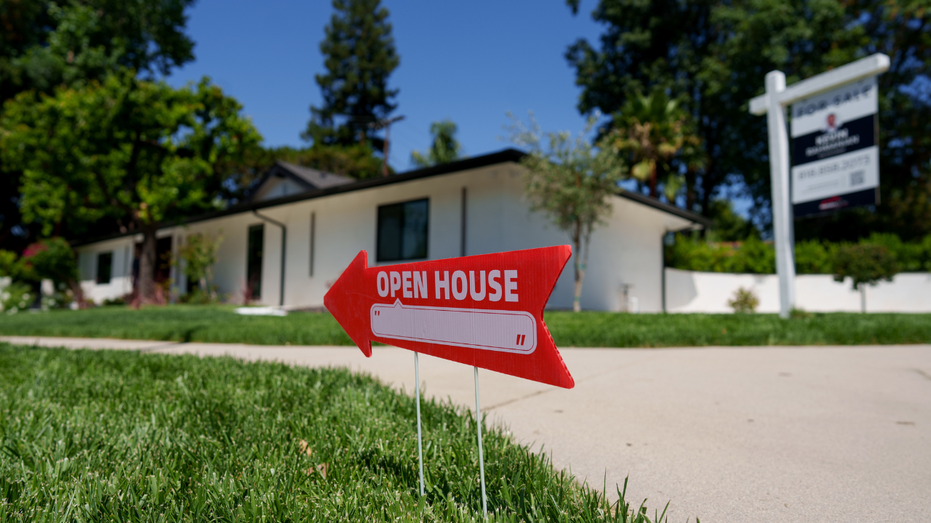 A home is seen in California with a an "open house" sign in front of it.