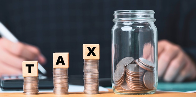 Saving for taxes with coins and a jar